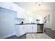 Bright eat-in kitchen featuring sleek black counters, white cabinets, and stainless steel appliances at 40 Eryn Ter, Covington, GA 30014