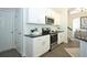 Efficient kitchen featuring stainless appliances, stylish fixtures and sleek black counters at 40 Eryn Ter, Covington, GA 30014