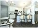 Charming eat-in kitchen featuring stainless appliances, counter seating and elegant fixtures at 40 Eryn Ter, Covington, GA 30014