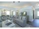 Open-concept living room featuring modern furniture, archways, and plenty of natural light at 40 Eryn Ter, Covington, GA 30014