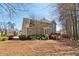 A spacious backyard with a cozy wooden deck on a two-story house at 1150 Cedar Bluff Sw Trl, Lilburn, GA 30047