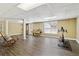 Spacious finished basement with wood floors, exercise equipment, and bright natural light at 1150 Cedar Bluff Sw Trl, Lilburn, GA 30047