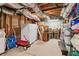 Unfinished basement with open ceilings, storage space, and ample room for various uses at 1150 Cedar Bluff Sw Trl, Lilburn, GA 30047