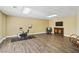 Spacious basement featuring wood floors, drop ceilings, and ample lighting at 1150 Cedar Bluff Sw Trl, Lilburn, GA 30047