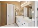 Bright bathroom featuring vanity, large mirror, and natural lighting at 1150 Cedar Bluff Sw Trl, Lilburn, GA 30047