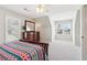 Bright bedroom featuring neutral walls, ceiling fan, closet, and natural light from the large windows at 1150 Cedar Bluff Sw Trl, Lilburn, GA 30047