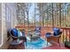 Cozy deck with comfortable seating offers an ideal spot for relaxation and enjoying the backyard view at 1150 Cedar Bluff Sw Trl, Lilburn, GA 30047