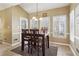 Bright breakfast nook with natural light, tiled floors, and access to the backyard at 1150 Cedar Bluff Sw Trl, Lilburn, GA 30047