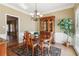 Formal dining area featuring hardwood floors, chandelier, and wainscoting detail at 1150 Cedar Bluff Sw Trl, Lilburn, GA 30047