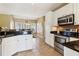 Modern kitchen with stainless steel appliances and granite countertops at 1150 Cedar Bluff Sw Trl, Lilburn, GA 30047