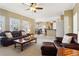 Living room with comfortable seating and view to dining and kitchen areas at 1150 Cedar Bluff Sw Trl, Lilburn, GA 30047
