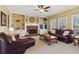 Cozy living room with fireplace, built-in shelves, and plush seating at 1150 Cedar Bluff Sw Trl, Lilburn, GA 30047