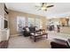 Living room with comfortable seating and view to dining area and deck at 1150 Cedar Bluff Sw Trl, Lilburn, GA 30047