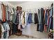 Spacious walk-in closet with ample hanging space and shelving for organized storage solutions at 1150 Cedar Bluff Sw Trl, Lilburn, GA 30047