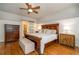 Large bedroom with hardwood floors, sliding barn door to bathroom at 260 Koller Dr, Powder Springs, GA 30127