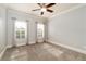 Spacious bedroom with neutral walls, plush carpet, and ample natural light at 260 Koller Dr, Powder Springs, GA 30127