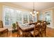 Bright dining room features a large table, hardwood floors, and access to sunroom at 260 Koller Dr, Powder Springs, GA 30127