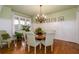 Elegant dining room with hardwood floors, chandelier, and wainscoting at 260 Koller Dr, Powder Springs, GA 30127