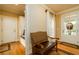 Bright entryway features hardwood floors and built-in bench at 260 Koller Dr, Powder Springs, GA 30127