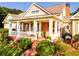 Home with a wrap-around porch and lush landscaping at 260 Koller Dr, Powder Springs, GA 30127