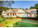 House with brick and siding exterior, walkway, and landscaping at 260 Koller Dr, Powder Springs, GA 30127