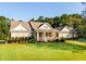 Brick and siding home with a large front porch and lush landscaping at 260 Koller Dr, Powder Springs, GA 30127