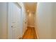Bright hallway with hardwood floors and neutral colored walls at 260 Koller Dr, Powder Springs, GA 30127