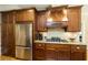 Well-equipped kitchen featuring granite countertops and wood cabinets at 260 Koller Dr, Powder Springs, GA 30127