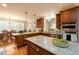 Spacious kitchen with granite island, custom cabinetry, and stainless steel appliances at 260 Koller Dr, Powder Springs, GA 30127