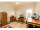 Home office with hardwood floors, built-in cabinets, and a large desk at 260 Koller Dr, Powder Springs, GA 30127