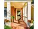 Brick porch with white columns and potted plants at 260 Koller Dr, Powder Springs, GA 30127