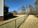 View of backyard, fence, and home at 284 Valley Way, Hampton, GA 30228