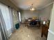 Bright dining room with hardwood floors and a view to the staircase at 284 Valley Way, Hampton, GA 30228