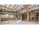 Partially finished basement has visible beams, open stud framing, and concrete floors at 3384 Hidden Acres Dr, Atlanta, GA 30340