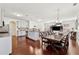 Open concept dining area with hardwood floors and large farmhouse table at 3443 Summerlin Pkwy, Lithia Springs, GA 30122