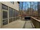 Exterior view of home showcasing a screened porch area and an open deck, ideal for outdoor living at 6860 Crofton Dr, Alpharetta, GA 30005