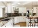 Well-appointed kitchen featuring stainless appliances and eat-in bar at 6860 Crofton Dr, Alpharetta, GA 30005