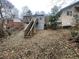 Backyard with a deck, wooden stairs and chain link fence at 1790 Spring Ave, East Point, GA 30344