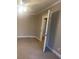 Bright bedroom with an open door to hallway at 1790 Spring Ave, East Point, GA 30344