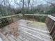 Wooden deck with steps leading to backyard at 1790 Spring Ave, East Point, GA 30344