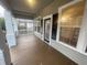Inviting porch featuring multiple windows, dark shutters, painted deck and a nice view at 1790 Spring Ave, East Point, GA 30344