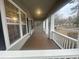 Spacious front porch featuring white railings, brick columns and the front windows at 1790 Spring Ave, East Point, GA 30344