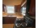 Kitchen features a tile backsplash, countertops and stainless steel microwave at 1790 Spring Ave, East Point, GA 30344