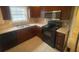Kitchen with stainless steel microwave, tile flooring, ample counter space and cabinets at 1790 Spring Ave, East Point, GA 30344