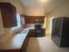 Spacious kitchen features stainless steel refrigerator, matching appliances and tile flooring at 1790 Spring Ave, East Point, GA 30344