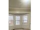 Window seat underneath three large windows provides an abundance of natural light at 1790 Spring Ave, East Point, GA 30344