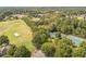 An aerial view of the golf course and tennis courts nestled within the community's landscape at 6615 Hampton Rock Ln, Cumming, GA 30041