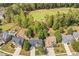 Aerial view of the neighborhood, showcasing the golf course and surrounding landscape at 6615 Hampton Rock Ln, Cumming, GA 30041