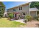 Spacious backyard with a patio, seating, and a lush lawn at 6615 Hampton Rock Ln, Cumming, GA 30041