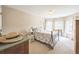 Bedroom with bay window, floral bedding, and plenty of natural light at 6615 Hampton Rock Ln, Cumming, GA 30041